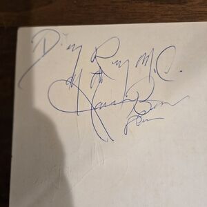 Blue Ink Signature on White Paper